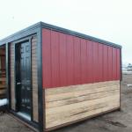 Steel clad sides and roof w/ plank lower 